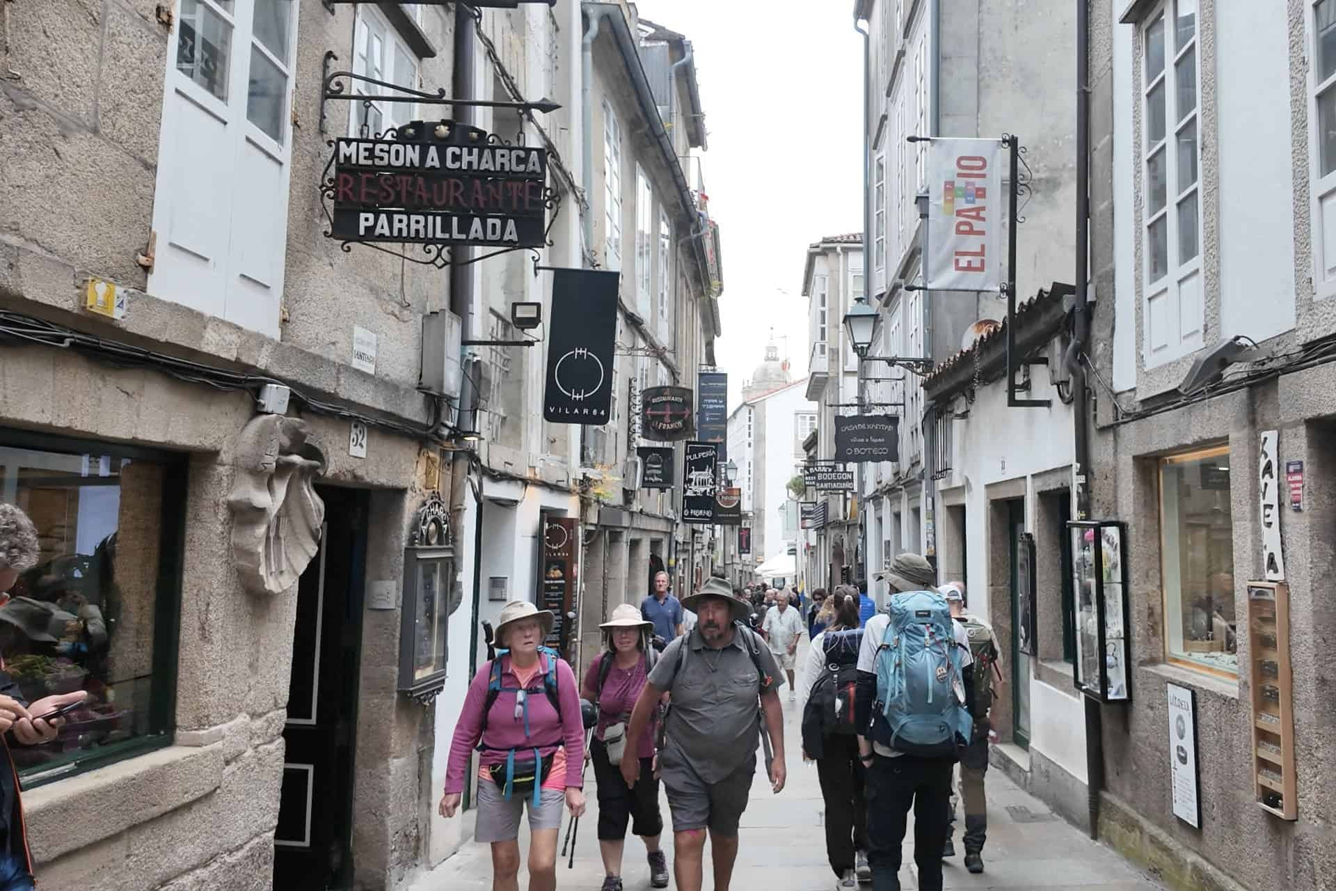 walking tour in the portuguese camino de santiago - arriving in the busy streets of Compostela walking tour in the portuguese camino de santiago - arriving in the busy streets of Compostela