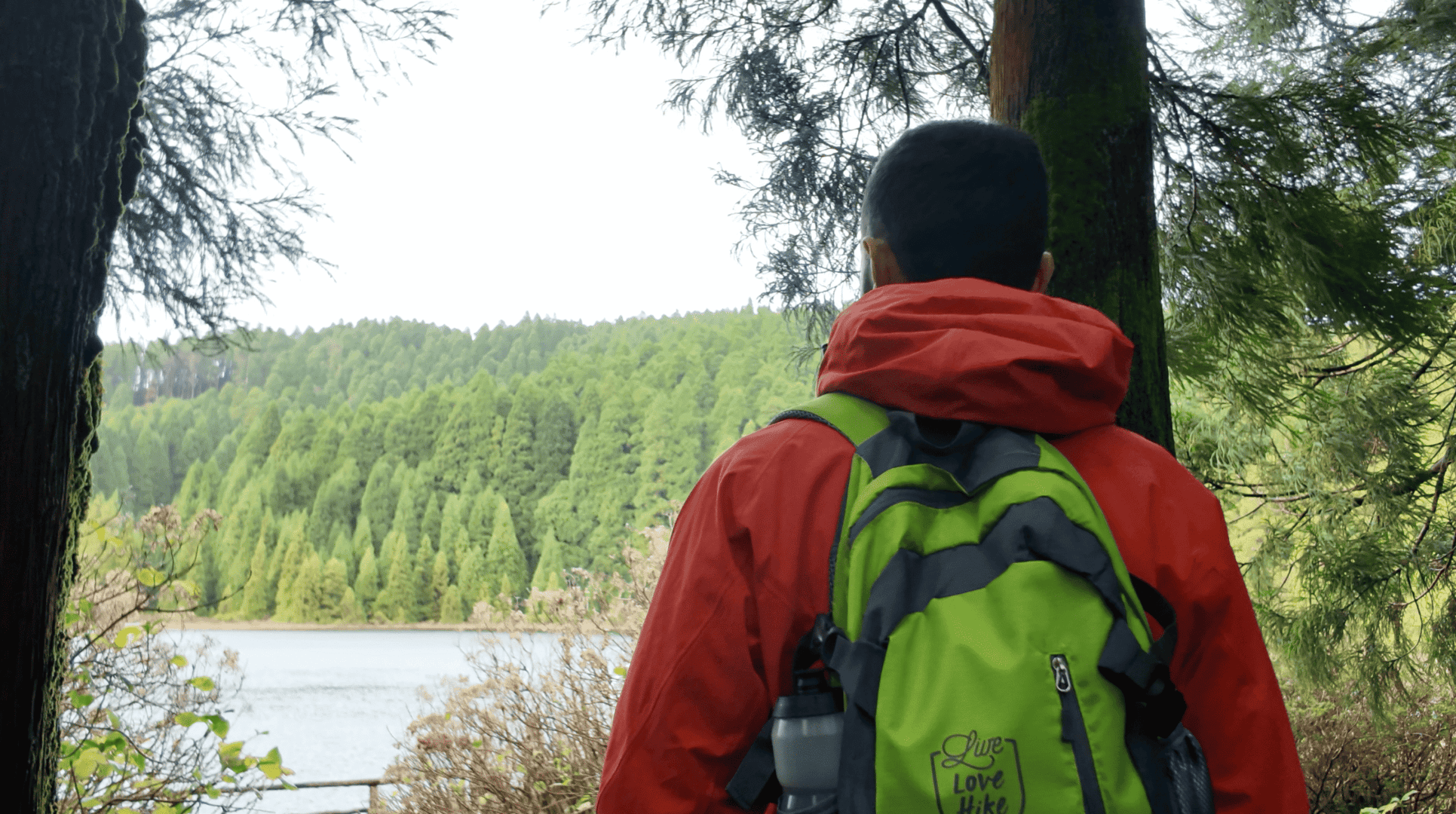 Hiker overlooking a crater lake on São Miguel Island during a self-guided Azores hiking tour