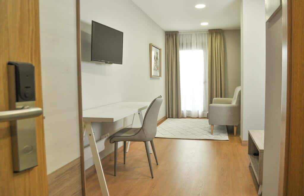 Comfortable hotel room with modern amenities near Torre do Río. Perfect for relaxing after cycling a.