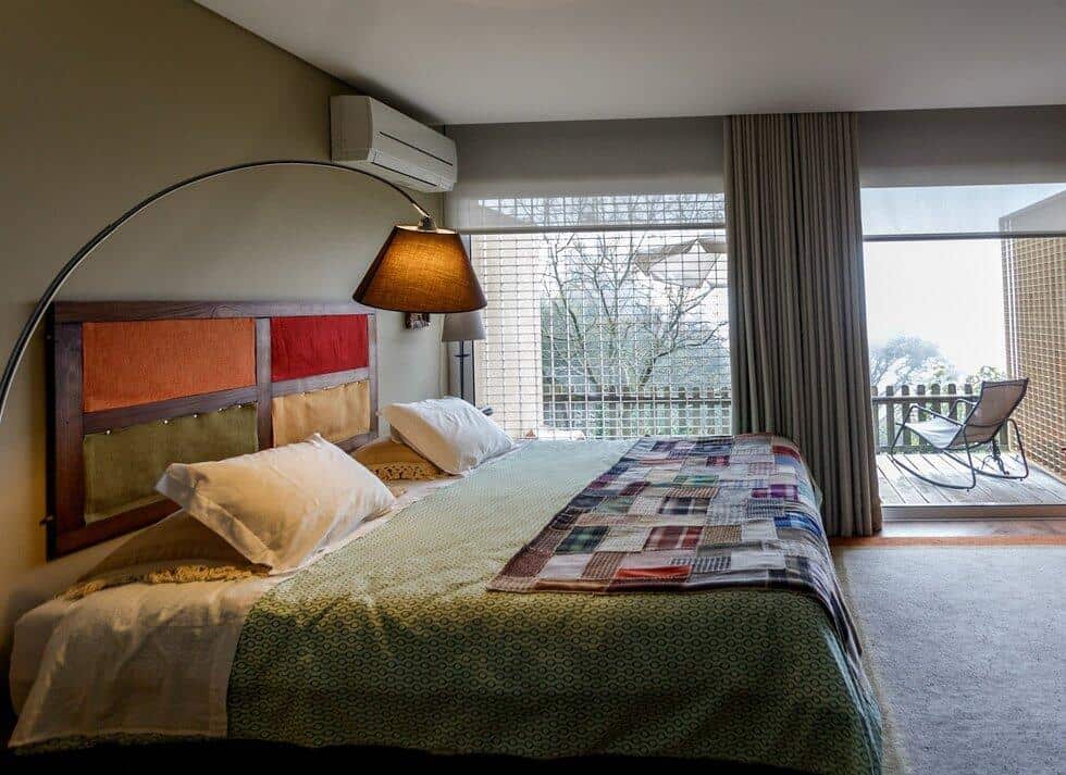 Comfortable hotel room at Quinta das Leiras with a large bed and balcony view.