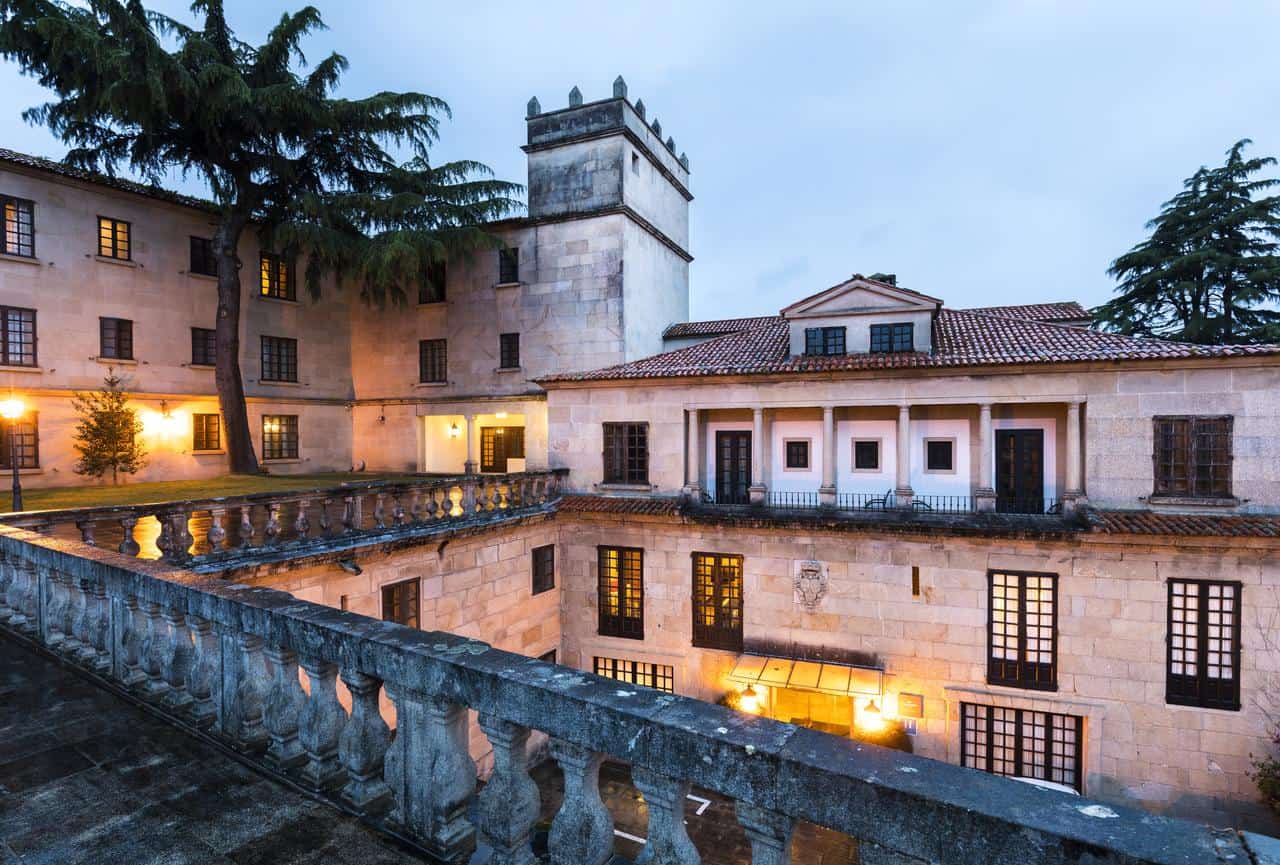 Historic Parador de Pontevedra with scenic views at dusk.