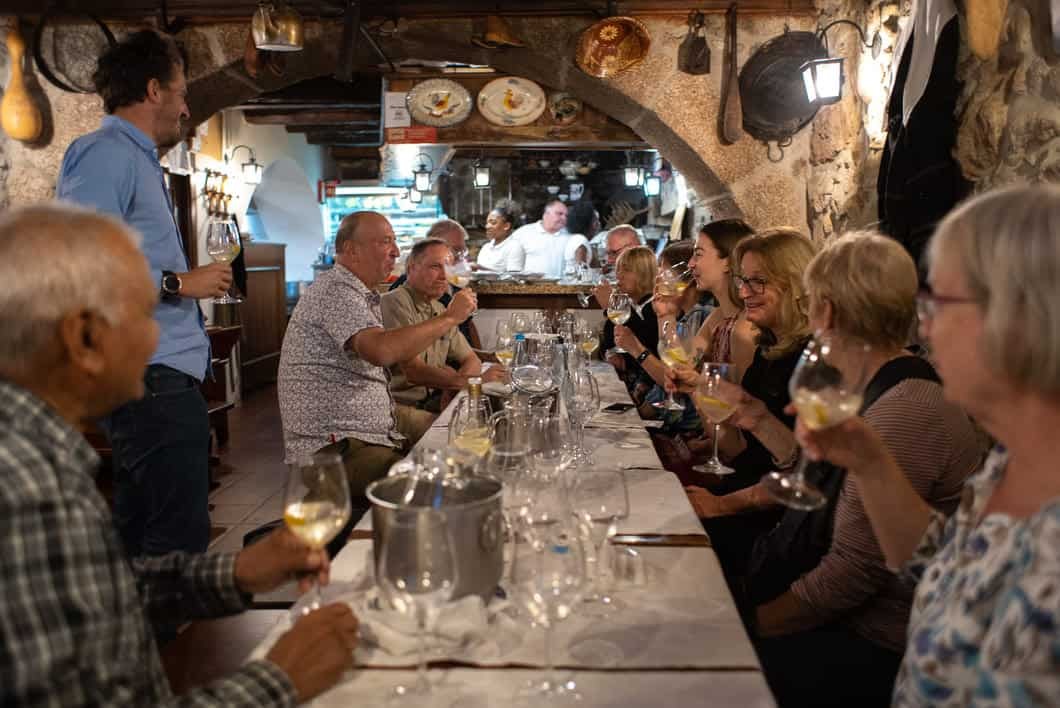 Enjoy an evening in a traditional Arcos de Valdevez restaurant, savoring authentic Minho cuisine and regional wines. Gather around a rustic table, soaking in the warm atmosphere, lively conversation, and genuine Portuguese hospitality.